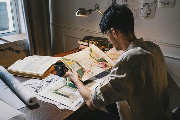 student-looking-at-interior-design-drawing student looking at their interior design drawing preparing for an art college interview coaching session
