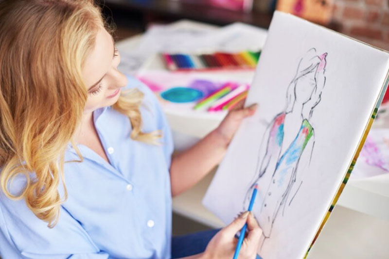 student engaged in art college preparation