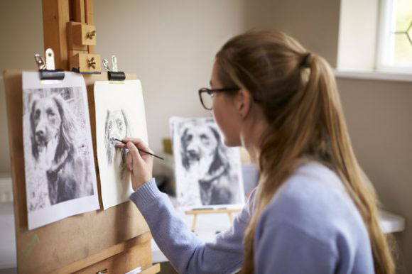 high school artist working on a drawing for artwork assessment